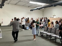 a group of people standing in a room