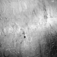 a black and white photo of a wall with writing on it