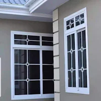 a house with a white window and a metal frame