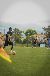 a group of people playing soccer on a field