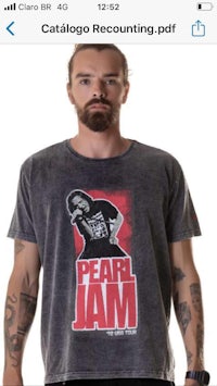 a man wearing a t - shirt that says pearl jam