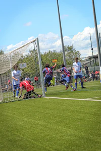 a group of people playing soccer on a field