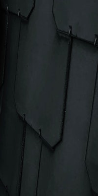 a close up of a black tiled roof