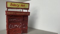 a model of a bakery with a sign on it