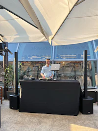 a man is standing in front of a table