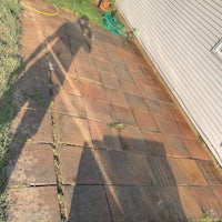 a brick patio with a shadow on it