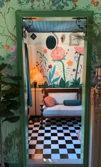 a room with green walls and a checkered floor