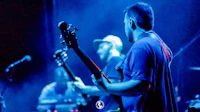 image may contain person, on stage, playing a musical instrument and concert