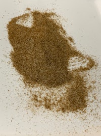 an image of a brown powder on a white plate