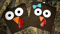 two turkey bags with eyes and bows on them