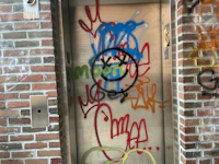 a door with graffiti on it