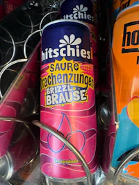 a can of ketchup is sitting on a shelf