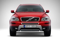 the front end of a red volvo suv