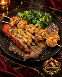 a black plate with steak, shrimp and broccoli on it