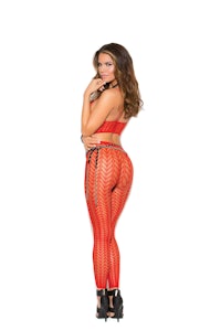 a woman in red fishnet leggings posing