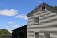 a white house with a black door