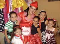 a group of children posing for a picture in a costume