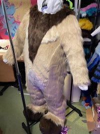 a bear costume is on display in a store