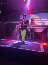 a man standing on stage at a concert