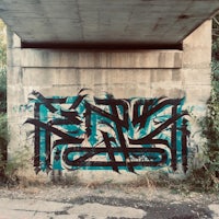 graffiti on a bridge under a bridge