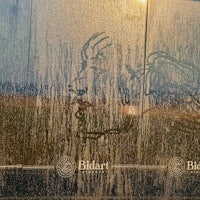 an image of a man with a horse on the side of a building