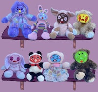 a group of stuffed animals sitting on a shelf