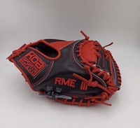 a red and black baseball mitt on a white background
