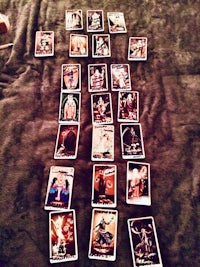 tarot cards are laid out on a bed