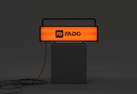 a radio sign with an orange light on it