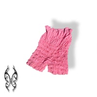 a pair of pink shorts on a white surface