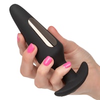 a woman's hand holding a black sex toy