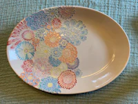 a plate with a colorful flower design on it