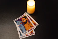 tarot cards with a candle next to them
