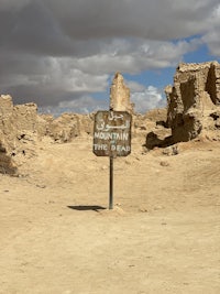a sign in the middle of a desert