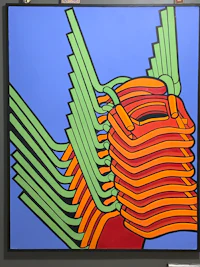 a painting with a red, orange, and green design