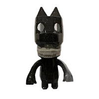 a black toy with a skull and crossbones on it