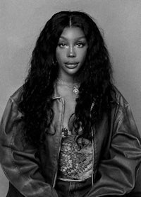 a black and white photo of a woman with long hair