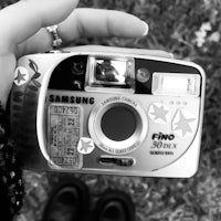 a black and white photo of a samsung camera