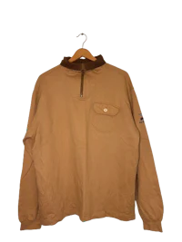 a tan sweatshirt hanging on a hanger