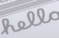the word hello is embroidered on a piece of paper