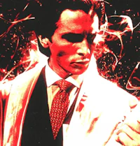 a man in a suit and tie holding a cigar