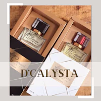 dcystala perfume in a box on a wooden table