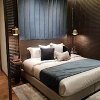 a bedroom with a bed and a bedside table