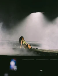 rihanna on stage with smoke in the background