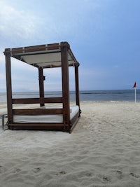 a beach chair sitting on the sand