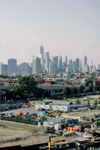 a view of the brooklyn skyline from a dock