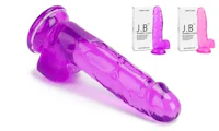 a purple sex toy in front of a box