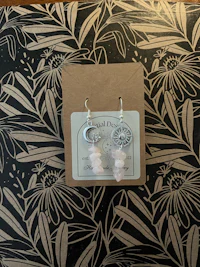 a pair of rose quartz earrings in a gift box