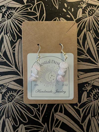 a pair of pink quartz earrings in a gift box