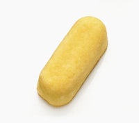 a yellow doughnut on a white background